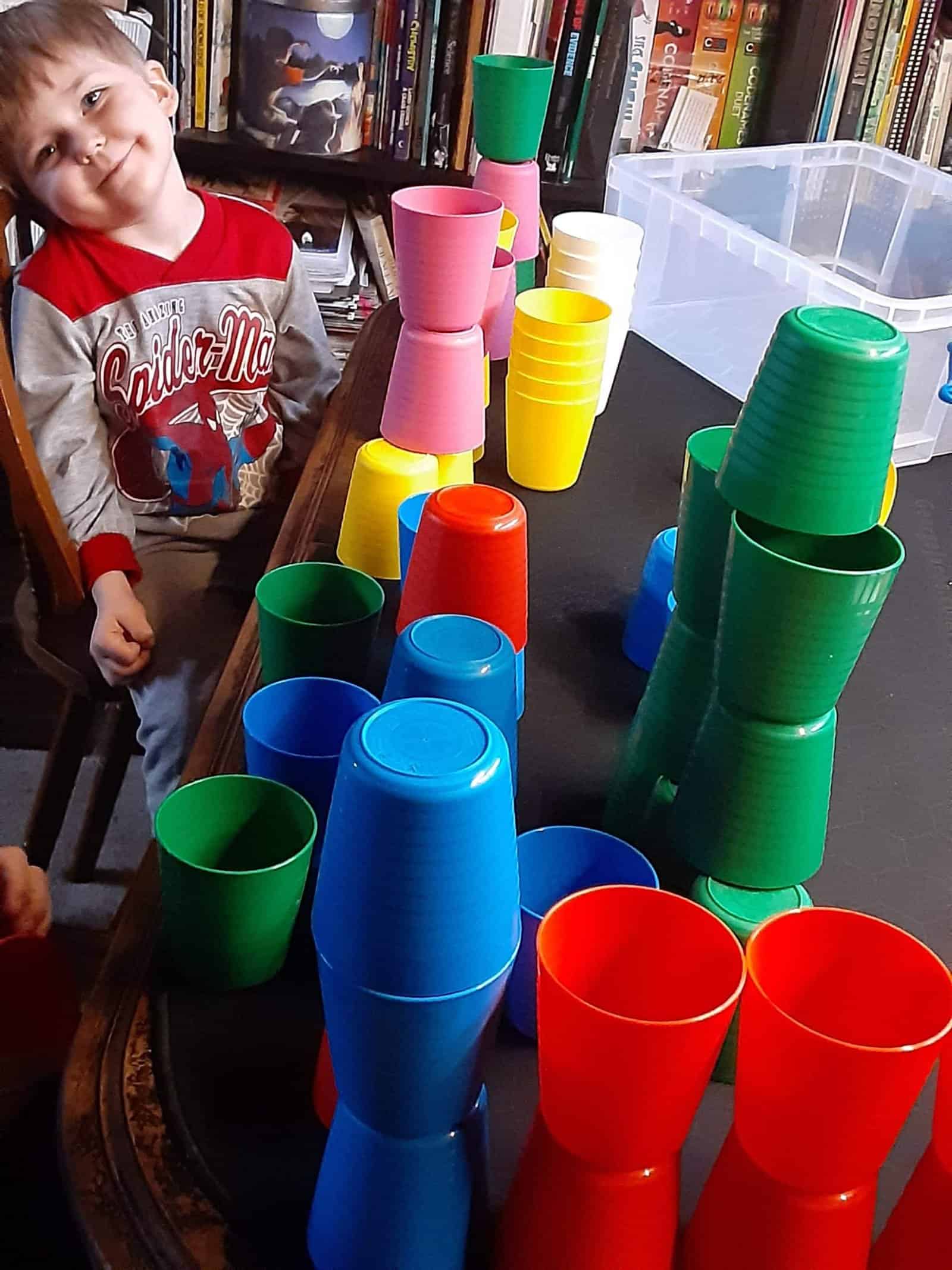 cups and a kid smiling