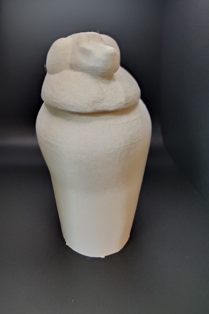 3D printed canopic jar with a baboon head.