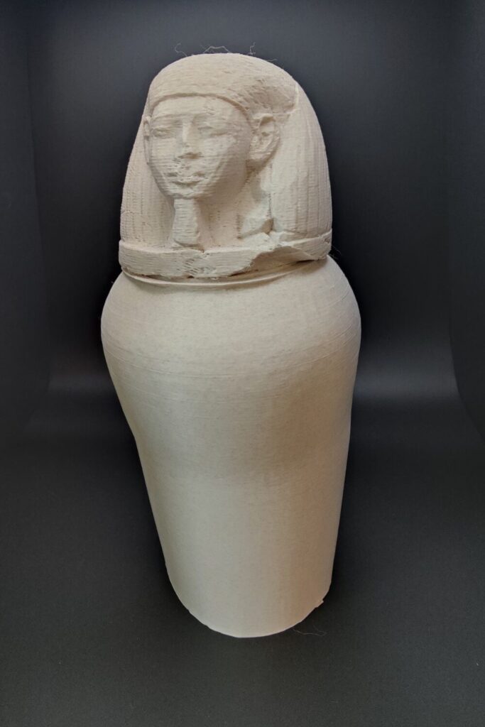 3D printed canopic jar with a human head.