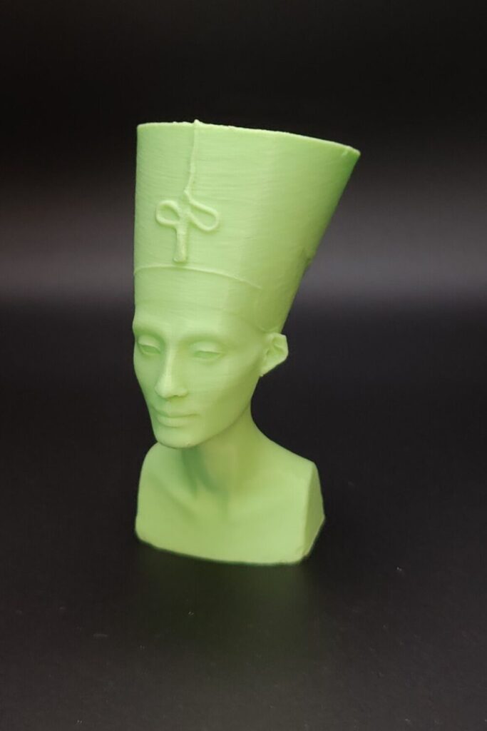 Light green 3D printed bust of a woman.
