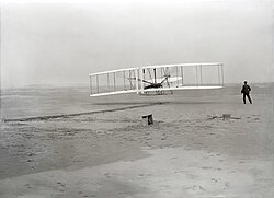 The Wright Brothers test out the Wright Flyer for the first time.